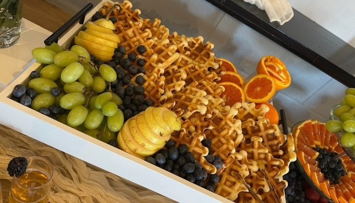 Interactive food station with chef preparing fresh dishes